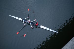two man rowing in the river