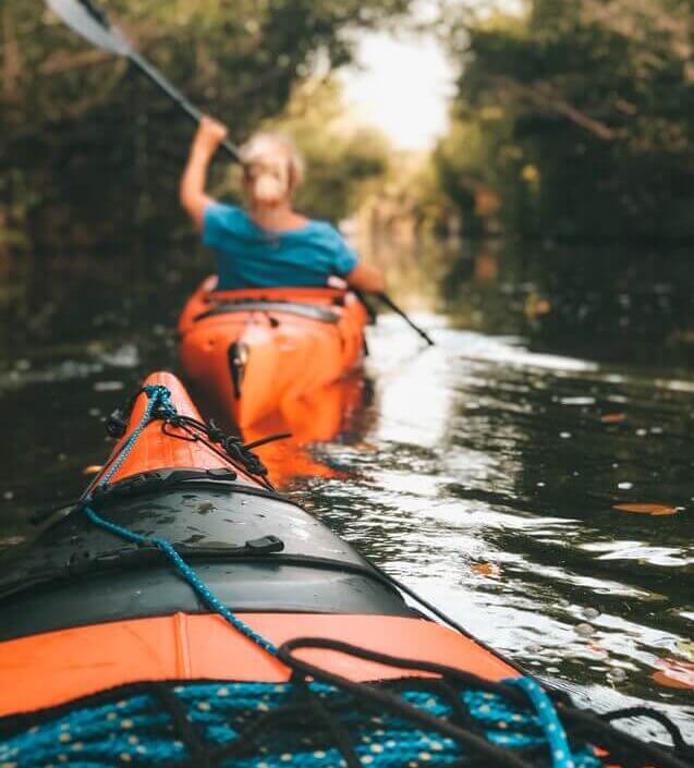 woman kayaking on the river