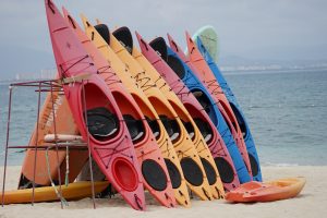 colorful kayaks at the beach