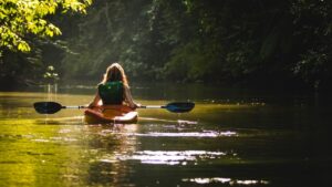 girl-paddling-whitewater