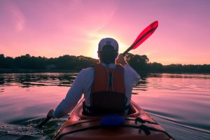 a kayaker during the sunset